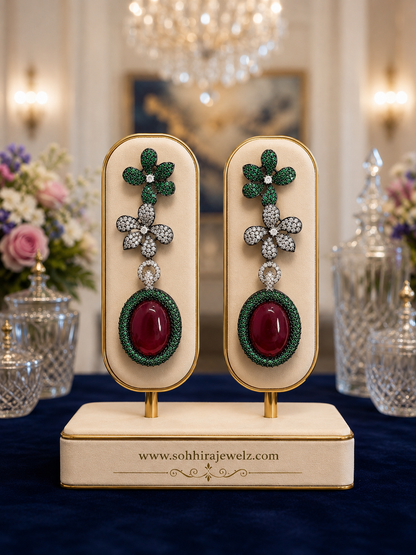 Emerald Garden Ruby Drop Earrings on luxury cream display stand