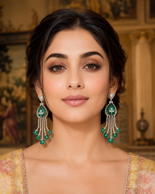 Model wearing Emerald Cascade Diamond Chandelier Earrings White Gold with yellow floral lehenga - front view