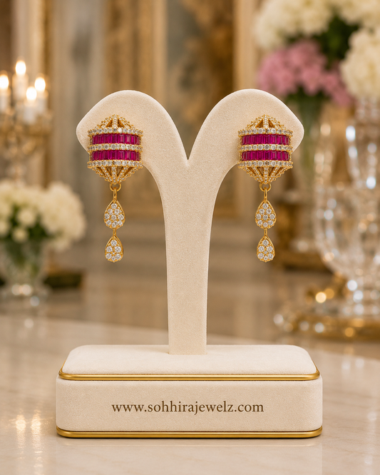 Ruby Lantern Diamond Necklace Set matching earrings on luxury cream Y-stand close up