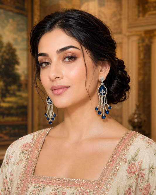Model wearing Sapphire Cascade Diamond Chandelier Earrings with blush floral lehenga - close up front view