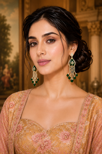 Model wearing Emerald Cascade Diamond Chandelier Earrings with peach lehenga - close up front view