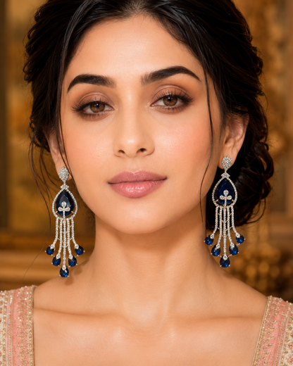 Model wearing Sapphire Cascade Diamond Chandelier Earrings with blush floral lehenga - extreme close up face